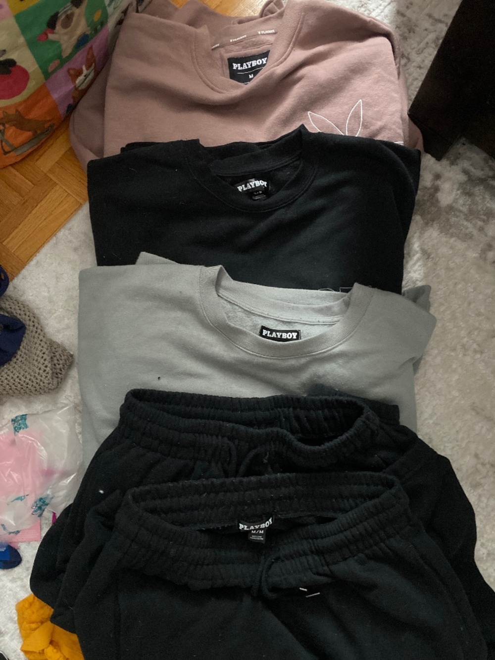 Playboy sweaters and jogging pants selling them all. Together for the price of 1